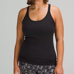 Black, ribbed tank top with a built-in bra.
